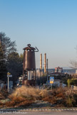 <center>Biver.</center>Lampe de mineur géante et les cheminées d'Alteo, l'usine d'alumine.