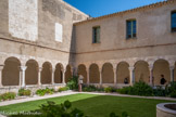 <center>Le cloître de Saint-Genis des Fontaines.</center>Pendant la Révolution française l'abbaye de Saint-Génis des Fontaines est supprimée et ses biens sont vendus comme Biens Nationaux en 1796. Après la Révolution, le cloître est pillé et démantelé. Des fragments sont trouvés sur le marché et ont intéressé des collectionneurs. En 1922, un antiquaire spécialisé, un marchand de cloître, cherchait à acquérir celui de Saint Genis alors propriété privée. Un des propriétaires, Edmond Joud, résiste, mais deux autres cèdent en 1924. Les trois-quarts du cloître sont démontés et emportés, l'essentiel est installé au château des Mesnuls, en Ile-de-France, mais deux arcs et trois colonnes sont donnés au Louvre, et quatre piliers sont achetés par le musée de Philadelphie (États-Unis).  Seul le quart sud-est, maintenu sur place, est classé Monument Historique.