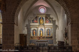 <center>L'abbaye Sainte-Marie-d'Arles-sur-Tech </center>La chapelle Saint-Benoit est située au sud-ouest du collatéral sud. L'abbaye se devait de vouer un culte au saint fondateur de l'ordre bénédictin. Une chapelle latérale lui est donc consacrée. Le retable date de 1644. Il présente la statue du saint dans une niche centrale. Saint Étienne et saint Isidore sont dans des niches latérales. Le retable est remarquable pour sa prédelle. Au couronnement du retable, une Vierge est de facture récente. Aux ailerons du retable, deux toiles peintes figurent à droite sainte Quitterie et à gauche sainte Afra. Ce sont deux martyres du IVe siècle, originaires de Galice pour la première et de Gérone pour la seconde.