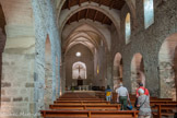 <center>L’abbaye de Saint-Michel de Cuxa</center>Nef de l'église. Le vaisseau central est éclairé en partie haute du côté sud par des fenêtres outrepassées et au-dessus du portail ouest par une grande fenêtre et une petite ouverture au sommet du pignon. Un transept bas très débordant, dont les deux croisillons communiquant avec la nef et les collatéraux par de grandes arcades outrepassées, sont voûtés en berceau. Les murs de la nef sont maçonnés en parties basses en grand appareil très irrégulier probablement de récupération qui donne une idée fondamentale de l'architecture romane alors que les claveaux des ouvertures outrepassées en fer à cheval sont montés en tas de charge.