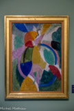 <center>Robert DELAUNAY 1885-1941</center>Femme à l'ombrelle ou La Parisienne, 1913.
Huile sur carton.
Don de Jacqueline Grammont et René de Montaigu, 1996
