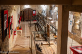 <center>Cordes-sur-ciel. Musée Charles Portal.</center>La broderie cordaise. Salle de la broderie. Cette salle a été aménagée pendant l’hiver 2018-2019. Elle accueille l’imposant métier à broder de type « Saint Gall » qui était exposé au MAMC depuis 1985. Le métier se trouve au dessus des fondations des premières maisons cordaises facilement observables.