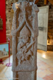 <center>Cordes-sur-ciel. Musée Charles Portal.</center>Sur le pilier, Saint Martin de Tours. La comparaison des représentations des mêmes personnages, sur le pilier et sur la croix, indique les différences d'époques de cet ensemble, il en est de même quand on observe la matière des grès : le pilier est plus grossier que celui de la croix. On peut donc affirmer qu’il s’agit d’un monument composite.