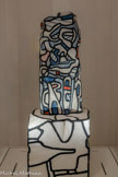 <center>Abbaye de Beaulieu-en-Rouergue  </center>Jean Dubuffet (Le Havre, 1901 - Paris, 1985) 
Portrait d’homme V
Novembre 1966 
Transfert sur polyester. 
La période dénommée L'Hourloupe (1962-1974) occupe une place à part dans l'œuvre de Jean Dubuffet. En 1966, il commence à travailler le polystyrène expansé. Facile à sculpter grâce à un fil de fer chauffé, ce matériau lui permet de projeter dans l'espace son écriture « hourloupéenne », faite de dessins semi-automatiques griffonnés au stylo bille pendant ses conversations téléphoniques. Extrêmement fragiles, ces œuvres en polystyrène expansé ont été pour partie transférées sur polyester, comme ce Portrait d’homme V.