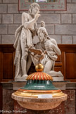 <center>L’église Saint Corneille de Puycelsi</center>Fonts baptismaux, marbre et bois polychrome et doré, 19e siècle. Cuve sur colonne en marbre, fermée par un couvercle en bois polychrome et doré, surmonté d'une colombe sur une boule. Une imposante statue du 19ème siècle représentet St Jean baptisant Jésus.