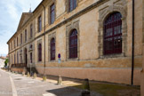 <center>Sorèze</center>Certains ont attribué la fondation de l'abbaye à Pépin le Bref, en 754, d'autres à Pépin Ier, roi d'Aquitaine en 817. Le seul acte authentique citant l'abbaye de Sorèze est le capitulaire du 10 juillet 817 de l'empereur Louis le Pieux plaçant l'abbaye parmi les abbayes de troisième classe ne devant que des prières pour la prospérité de l'empereur et le bonheur de l'État. La ville de Sorèze est prise par les protestants le 5 octobre 1571, puis de nouveau 5 juin 1573. Ils font de la ville leur place-forte, détruisant entièrement l'abbaye et ne laissant de l'église paroissiale Saint-Martin que l'abside et le clocher qui le surmonte.
À partir de 1638 commence l'ultime reconstruction de l'abbatiale Notre-Dame-de-la-Paix grâce aux bénédictins de la congrégation de Saint-Maur venus de Paris pour la reconstruction qui durera quatre ans. Les bâtiments de l'abbaye actuels, en dehors de l'église qui a été démolie avant 1859, ont été reconstruits en 1778-1781 pour la basse-cour, en 1782-1783 pour les bâtiments autour de la cour d'honneur, et vers 1785 pour le cloître.