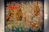 <center>Le musée Dom Robert et de la tapisserie du XXe siècle</center>Le Printemps.
 D'après DOM ROBERT (1907-1997)
Tapisserie de basse lisse, Exemplaire unique. Laine et coton
Atelier Tabard, Aubusson, 1942. Carton de 1942, 256,4 x 318,8 cm. <br>
Cette deuxième tapisserie de Dom Robert est restée un exemplaire unique. En 1942, avec Le Printemps, l’artiste poursuit l’exploration du thème des saisons, qu’il prolonge avec L’Automne en 1943. Le cartouche écrit en latin en partie haute, à la manière des des enluminures, donne le ton : Car déjà l’hiver est passé, les fleurs sont apparues », (Cantique des Cantiques 2,11). Dom Robert opère ici la jonction entre la tradition de la miniature persane et celle des tapisseries de mille-fleurs du XVIe siècle. Les fleurs et les papillons deviendront des éléments majeurs de son vocabulaire pictural.
