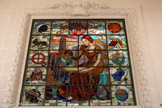 <center>Bibliothèque Municipale</center>Le vitrail. (Envers)
André RAPP (1903-1979). Maître verrier D'après un dessin d'Édouard Bouillière.
Le vitrail intitulé «L'Éducation de l’Enfance» montre une femme et un enfant lisant devant la basilique Saint-Sernin. Autour d‘eux figurent les symboles des disciplines à apprendre : palette pour les arts, bateau pour les voyages, roue dentée pour la mécanique, panthère pour la faune, pyramides pour l’histoire et l’architecture, soleil et lune pour l’astronomie, sirène pour la mythologie, lotus pour la flore, mappemonde pour la géographie- L’ensemble est surmonté des armoiries de Toulouse.