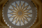 <center>Bibliothèque Municipale</center>La rosace, composée de centaines de cabochons de verre bleu et orange.