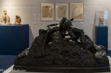 <center>Faune guettant une nymphe.</center>Paul Dardé. Bronze, 1924.