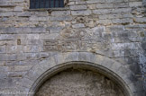 <center></center><center>Malaucène. </center> Église Saint-Michel. La façade Nord, visible de la rue percée en 1822 dans l’ancien cimetière, comporte une grande porte romane, ouverte en 1574 pour remplacer la grande porte murée dès 1560 par crainte des Huguenots.