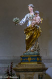 <center>La crypte</center>Vierge au bouquet offerte au sanctuaire par Joseph-Elie Escaramagne.