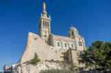 <center>Notre-dame de la Garde.</center>Le 23 juin 1853 Espérandieu est nommé architecte et met au point le projet. Bien qu'étant protestant, il ne semble pas que sa religion fut une cause majeure des difficultés rencontrées avec la commission du sanctuaire chargée de la mise en œuvre des travaux. Celle-ci décida, sans consultation de l'architecte, de ne pas mettre les travaux en adjudication pour faire jouer la concurrence, mais de les confier le 9 août 1853 directement à Pierre Bérenger, entrepreneur et architecte de l'église Saint-Michel, qui avait lui-même proposé un des projets néogothiques et qui était un proche de Mgr Mazenod. La commission décide également de lui imposer le choix d'artistes tels que le sculpteur Joseph Marius Ramus ou le peintre Karl Müller de Düsseldorf sans se soucier de savoir si leurs œuvres s'adapteront à l'architecture retenue. Le choix de Karl Müller ne fut pas confirmé par la suite, ce qui permit à l'architecte de s'orienter vers une décoration de mosaïques.