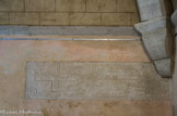 <center>Le petit cloître</center>Le tombeau situé dans le mur du cloître correspond à la sépulture du fondateur de la Chartreuse de Valbonne Guilhem de Vénéjan. On retrouve sur la pierre gravée, la croix hampée et la crosse tournée vers l'intérieur, symbole d'un évêque dont les fonctions sont internes.