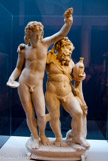 <center>Bacchus et Silène.</center><center>Bacchus et Silène.</center>Cette statuette représente Bacchus, le dieu du vin et de l'ivresse et Silène, le plus âgé et le plus sage des membres de son cortège. Cette statuette représente Bacchus, le dieu du vin et de l'ivresse et Silène, le plus âgé et le plus sage des membres de son cortège. Au début, il existait dans la collection du prince Borghèse un torse sans doute d’Apollon et la tête et le buste poilu de Silène. Le sculpteur a fait d’Apollon Bacchus, en rajoutant la tête, les bras, des grappes de raisin, une coupe, et a complété Silène avec des bras, des jambes, la gourde et il l’a appuyé sur un support. Cela montre bien l’admiration que l’on avait pour l’antique au XVIII siècle.