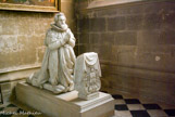 <center><center>Chapelle des fonds baptismaux. </center> </center><center>Chapelle des fonds baptismaux. </center> Priant du maréchal François de la Grange d'Arquian, mort en 1617, par Michel Bourdin.