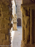 <center></center><center>Saint-Donat-sur-l'Herbasse. </center>Le cloitre de la collégiale. Sur les 4 piles d’angle étaient sculptés les bas-reliefs des évangélistes, à rapprocher de la statuaire viennoise du XIIe siècle. Contre le mur, St Donat repoussant le dragon.