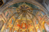 <center>Millau</center>Église Notre-Dame de l’Espinasse. . La fresque qui couvre la voûte a été réalisée en 1939 par le peintre et compagnon du devoir Jean Bernard. Elle représente le Couronnement de la Vierge par les trois personnes de la Trinité occupe le centre de la voûte. La scène est surmontée des anges qui, avec les prophètes Jérémie, Isaïe, Ézéchiel et Daniel, contribuent à la solennité de l'événement. Elle rappelle, au travers de la représentation du peuple, les artisans des métiers de la peau et du gant qui font alors la richesse de la ville.