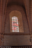 <center>Millau</center>Église Notre-Dame de l’Espinasse. Huit verrières en 1982 par Claude Baillon. Son approche sensitive l'incite à traduire dans un nouveau langage abstrait les paysages caussenards par des lignes courbes horizontales.
Ces lignes répondent au bâtiment lui-même, tant à l'horizontalité de l'appareillage que des tribunes qui courent à la naissance de la voûte.
Par convention, et parce qu'ils résistent mieux à la lumière, des tons chauds sont choisis pour orner les verrières sud tandis que les tons froids sont préférés côté nord. Le mélange des couleurs assure par ailleurs la reconstitution de la lumière blanche à l'intérieur de l'édifice.