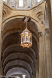 <center>L'église abbatiale Sainte-Foy</center>Le reliquaire de Sainte Foy et la croix du Sauveur.
La communauté des Prémontrés de Conques a fait appel à l’orfèvre Goudji pour créer un reliquaire qui « habite » le sanctuaire en mémoire de sainte Foy martyre et des témoins du Christ aujourd’hui.
Le reliquaire, suspendu entre les colonnes de l’abside, est accessible aux pèlerins par le déambulatoire, comme autrefois la statue en Majesté de sainte Foy. Surmonté de la colombe évoquant l’Esprit Saint, il contient une relique du corps de sainte Foy, martyre en 303 à Agen.
Il a été béni le 12 octobre 2014, au cours de la messe de la fête de sainte Foy. Une croix reliquaire représentant le Christ-Prêtre lui est associée depuis la Pentecôte 2015.
En forme de tour octogonale comme le clocher de l’abbatiale, le reliquaire de sainte Foy manifeste sa présence lumineuse, telle une petite lumière dans la nuit, et veut inviter à la prière pour les chrétiens persécutés et pour la libération des captifs.