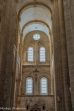 <center>L'église abbatiale Sainte-Foy</center>Transept sud. Les vitraux de Pierre Soulages réalisés entre 1987 et 1994 en collaboration avec le verrier Jean-Dominique Fleury ajoutent un aspect contemporain à l'atmosphère sobre et recueillie de l'église.