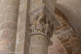 <center>L'église abbatiale Sainte-Foy</center>Les chapiteaux de l'abbatiale se répartissent pour l'essentiel au niveau des retombées des grandes arcades en berceau plein cintre du déambulatoire, du transept et de la nef, soit à l'étage des tribunes. Les chapiteaux sont principalement à thème végétal, les historiés quant à eux sont peu nombreux.