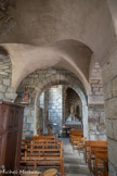 <center>Nasbinals. Église Sainte-Marie. </center>Deux chapelles voûtées d'arêtes constituant un collatéral nord. Une vierge en pierre légèrement polychromée trône, depuis un récent don fait à la paroisse, sur l'autel de l'absidiole Nord.
Provenant de la région de Paray-le-Monial, cette statue de facture populaire peut dater de la fin de l'époque gothique : la vierge tient l’Enfant sur le bras gauche, ainsi qu'une pomme à la main droite, d’où le nom de 