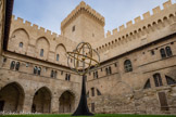 <center>Cloître Benoît XII</center>L'aile des Familiers, à l'ouest, et la chapelle de Benoît XII, au nord avec au milieu, la tour de la campane. L'aile des Familiers regroupe les logements de la Curie. Elle se compose d'un rez-de-chaussée et de deux étages. La chapelle de Benoît XII est subdivisée en deux parties : la chapelle basse ou obscure, qui fut rapidement transformée en réserve ; la chapelle haute ou Grande Chapelle.
