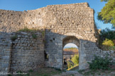 <center>Le Château d’Allègre.</center>Porche d'entrée. A gauche, la Chapelle dans le rempart. C’était à l’origine, au XIème siècle, une chapelle paroissiale indépendante avec une nef voûtée couverte d'un toit de lauzes. Elle a été incorporée au rempart, construit durant la Guerre de Cent Ans, par économie de moyens mais aussi pour sécuriser son accès. Une astuce architecturale, à gauche du porche d'entrée, a permis de ne pas occulter la fenêtre du chœur.
Alors que le château est déjà en ruine, la chapelle est encore utilisée pour des baptêmes ou des messes funéraires au milieu du XVIIème siècle. Plusieurs sépultures ont été découvertes dans l'espace situé devant son entrée.