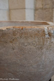 <center>Meysse</center>Les fonts baptismaux du 17e siècle prennent place à gauche du portail principal. Ils portent la date 1616, date de la restauration de l'église après les guerres de Religion.