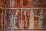 <center>Chapelle Notre-Dame de Ben-Va</center>Registre inférieur. LES SAINTES PROVENÇALES - MARTHE, p. 11, Marta (Fêtée le 29 Juillet) et sa sœur MARIE MADELEINE Madalena (fêtée le 22 juillet), la pécheresse. Elles sont représentées en pied, protectrices vénérées des Saintes-Maries-de-la-Mer, de Tarascon et de St Maximin la Ste Baume. Marie-Madeleine, au fin visage, portant le précieux vase de parfum, protectrice des moissons. MARTHE repousse à ses pieds la tarasque à l'aide d'un goupillon pour asperger d'eau bénite. C'est la patronne des cuisinières. Les Vertus. Un groupe de 6 femmes, debout et figurées jeunes, désignées dans la confusion à l'aide de l'alphabet gothique, portant souvent un attribut permettant de les reconnaître. Presque toutes ayant une coiffe sur leur tête, étant revêtues de robes identiques de couleur bleu-indigo, bleu-vert, rouge-violet.
La quenouille de la DILIGENCE ou Prudence. La quenouille de la DILIGENCE ou Prudence.
Les 2 bébés de la CHARITE ou Espérance. Par erreur le peintre l'a nommé Abstinence.
Les flacons de la TEMPERANCE