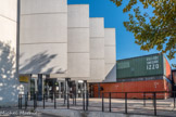 <center>Collège Jean-Claude Izzo.</center>Construit en 2005. Architectes :  R. Isnardon, F. Lacube, J. Redondo. Entrée composite avec conteneurs et voiles de béton.
