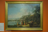 <center>Reflets du Nil</center>Guiseppe Zais (Canale d’Agordo, 1709 - Trévise, 1784) Moïse sauvé des eaux
18e siècle Huile sur toile CHAMBÉRY, MUSÉE DES BEAUX-ARTS. <br>
Selon la Bible, les Hébreux devinrent si nombreux en Égypte que Pharaon les réduisit en esclavage et décida de faire mourir tous leurs nouveau-nés mâles. Afin de sauver son enfant, une mère « prit une corbeille de jonc [qu’elle] déposa [...] au bord du Nil, au milieu des roseaux. La fille de Pharaon le recueillit et le traita comme son propre fils ; elle lui donna le nom de Moïse, signifiant : tiré des eaux » (Exode 2, 3-10).
L’épisode est largement repris par les artistes européens. Guiseppe Zais, peintre italien spécialisé dans les paysages et les fresques décoratives, mêle ici fantaisie et réalisme et s’inspire de l’épisode pour représenter un paysage fluvial. Le Nil, entouré d’une végétation européenne, prend une large place dans la partie gauche du tableau, tandis que la fille de Pharaon et sa suite sont vêtues à la mode du siècle.