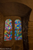 <center>Vogüé</center>Le château de Vogüé. La chapelle, éclairée par deux baies géminées romanes, était à l'origine plus vaste. La construction du grand escalier au XVIIe siècle en a diminué le volume. Les vitraux ont été créés en 1980 par le peintre Alfred Manessier.